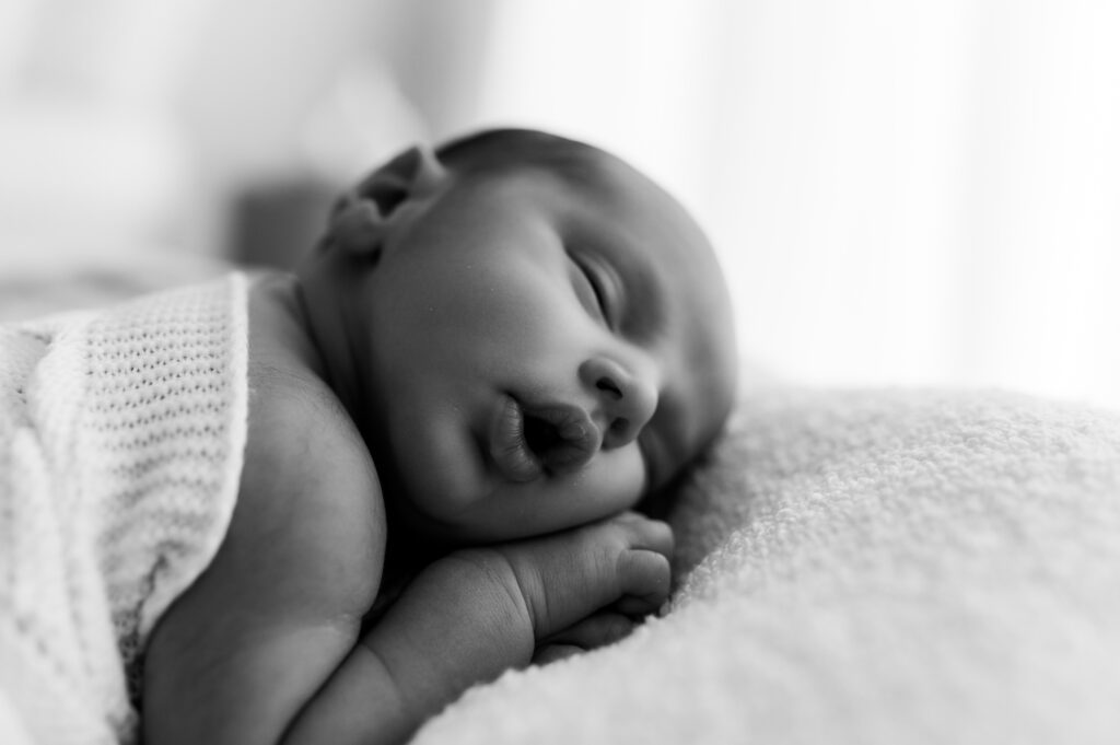 Sweet newborn baby photographed in a neutral Somerset WI photography studio