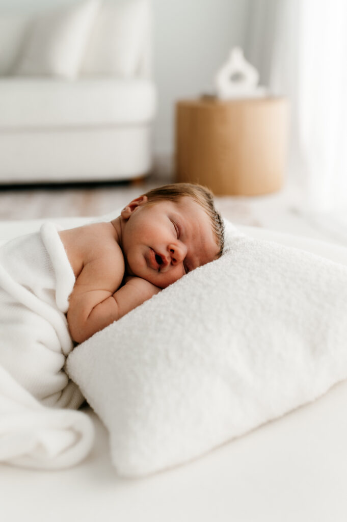 Sweet newborn baby photographed in a neutral Somerset WI photography studio