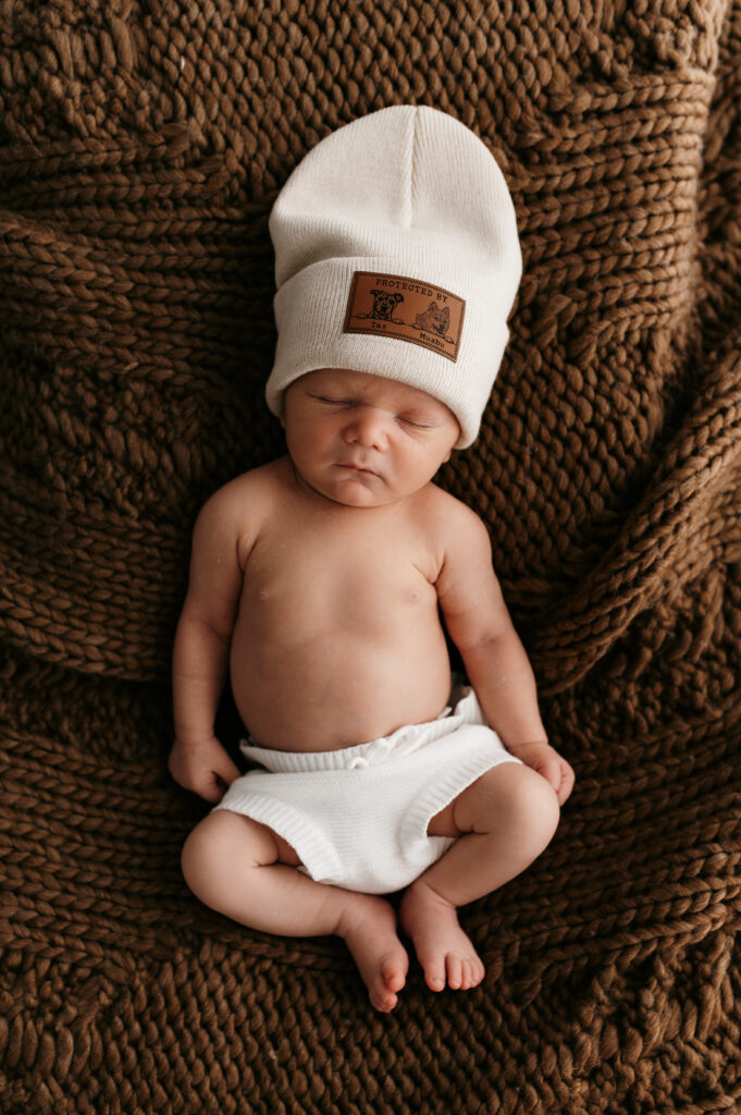 Sleepy newborn baby photographed in a neutral Somerset WI photography studio