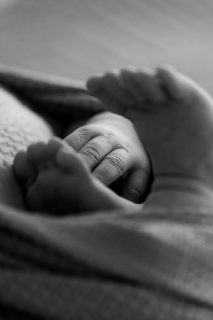 Baby feet pressed together while lying peaceful