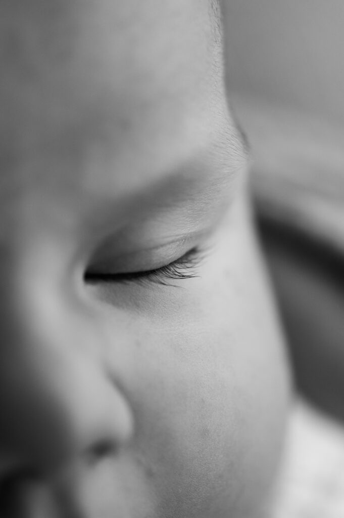 Close up of newborn baby eye in soft natural light