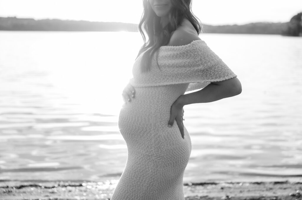 Beautiful black and white maternity photo by the water