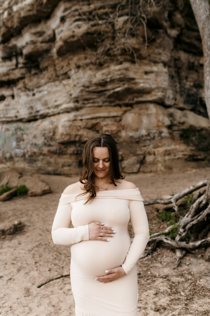 Maternity photo with mom looking down at her belly