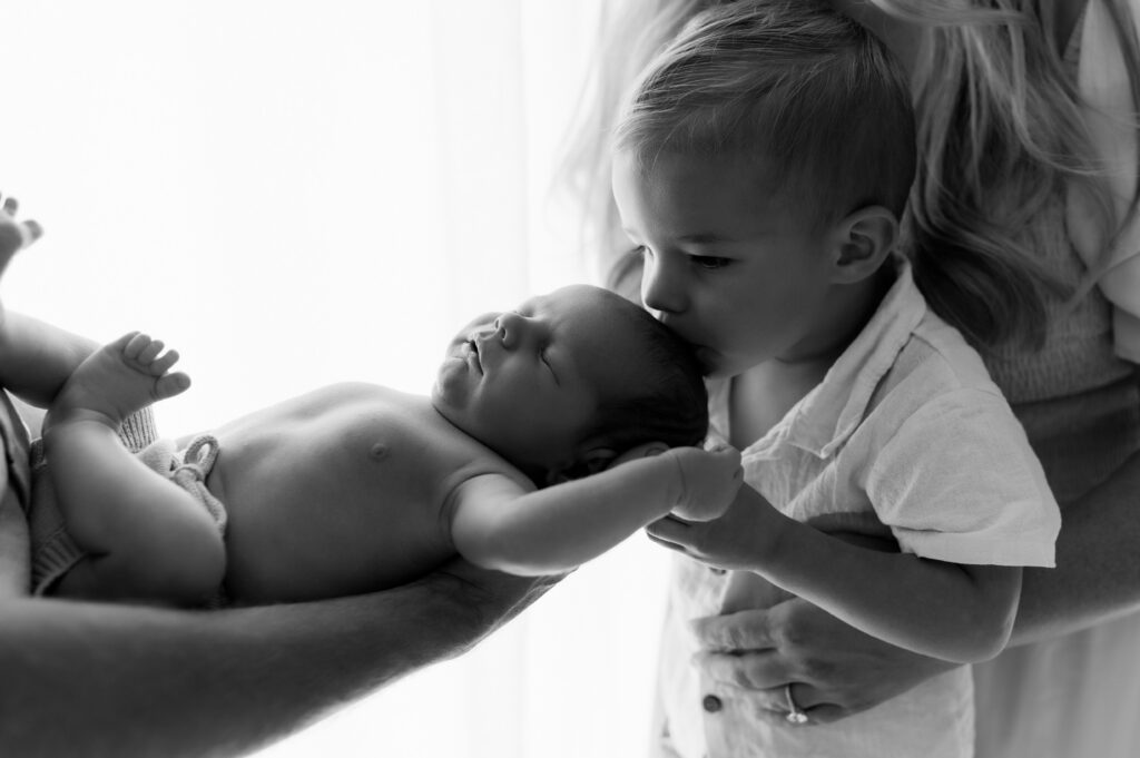 Newborn studio session with soft natural lighting and timeless editing