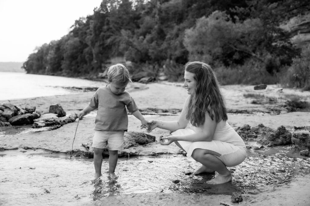 Mom and son playing on the beach.