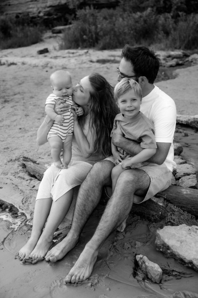 Black and white photo of family being candid together.